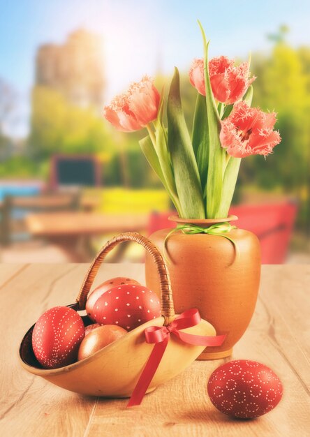 Easter eggs and tulips in outdoor cafe