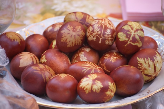 Easter eggs with leaf patterns on the table