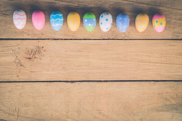 easter eggs on wooden background with space