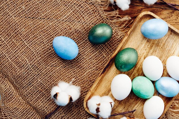 Easter eggs on wooden board decoration holiday tradition closeup high quality photo