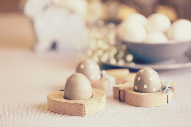 Easter eggs in wooden stands close up