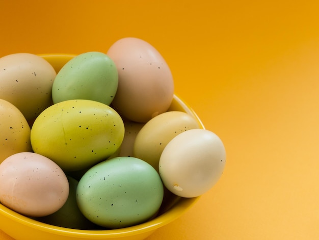 Easter eggs in yellow bowl.