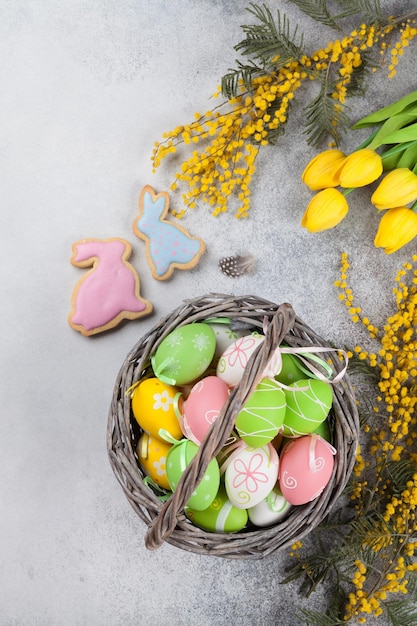 Easter eggs and yellow flowers Greeting card