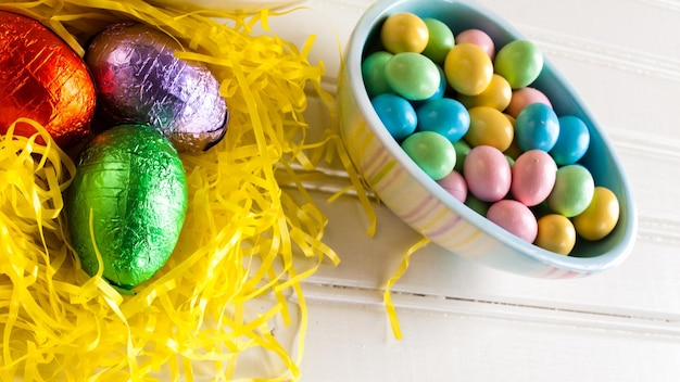 Easter eggs in yellow grass.