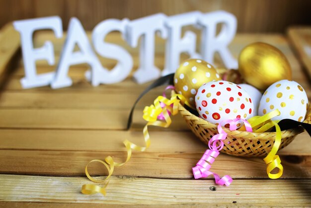 Easter flower eggs wooden background
