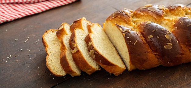 Easter greek tsoureki braid sweet bread brioche on wood