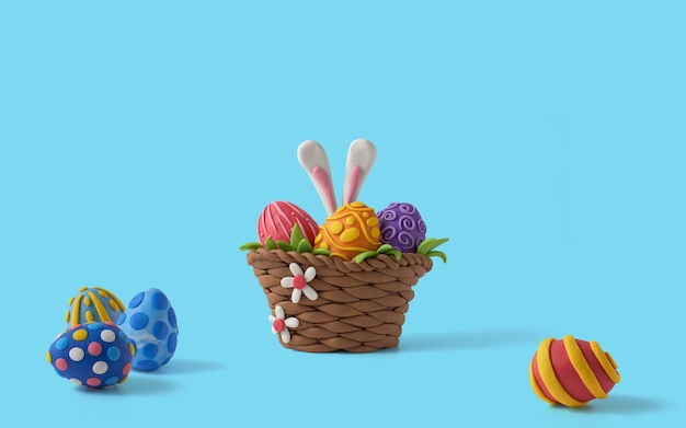 Пасхальная открытка с дизайном корзины с пасхальными яйцами и ушками кролика Ручная работа из пластилина на