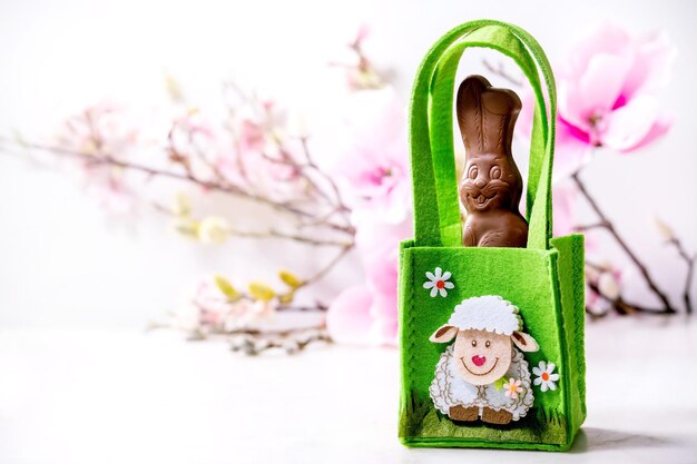 Easter greeting card with chocolate sweets rabbit