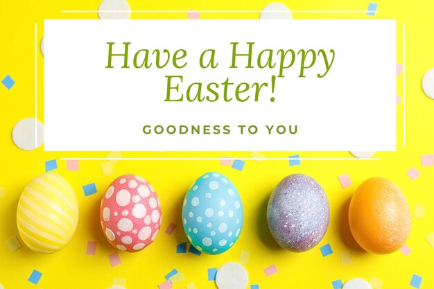 Easter greeting inscription with painted eggs on a yellow background