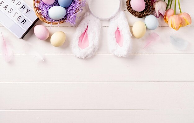 Easter holiday background easter holiday background with decorations on white wooden backdrop