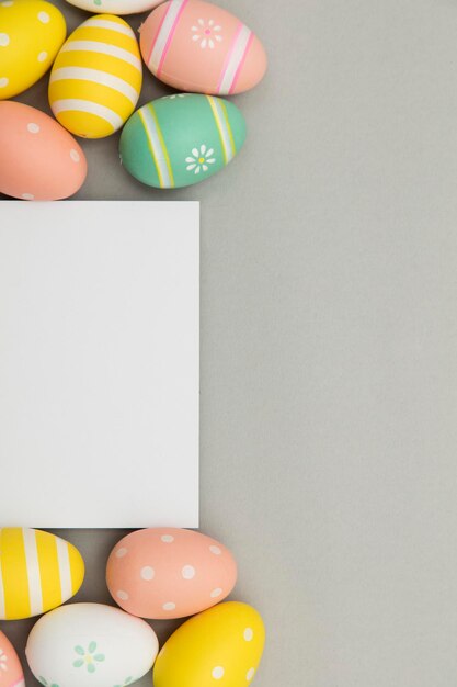 Easter holiday background Pastel coloured decorated easter eggs with a blank white label