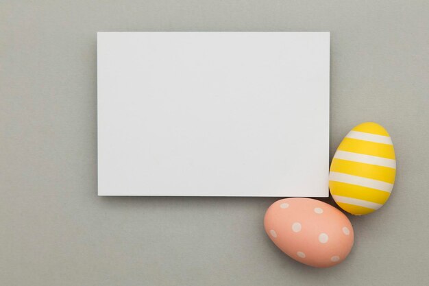 Easter holiday background Pastel coloured decorated easter eggs with a blank white label