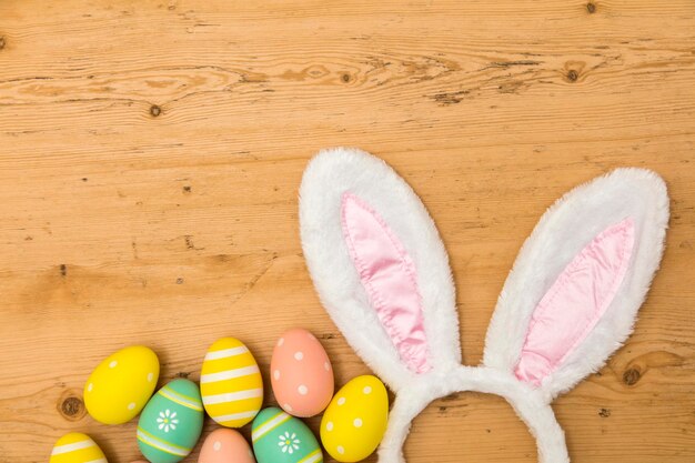 Easter holiday background with bunny ears and easter eggs