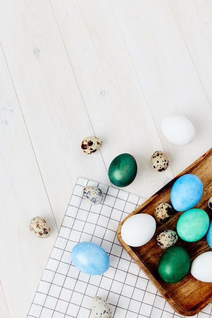 Easter holiday colorful eggs on wooden background top view church traditions