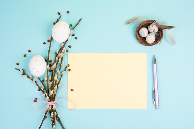 Easter holiday and spring, pastel colors, nest with eggs, pussy willow, greeting card