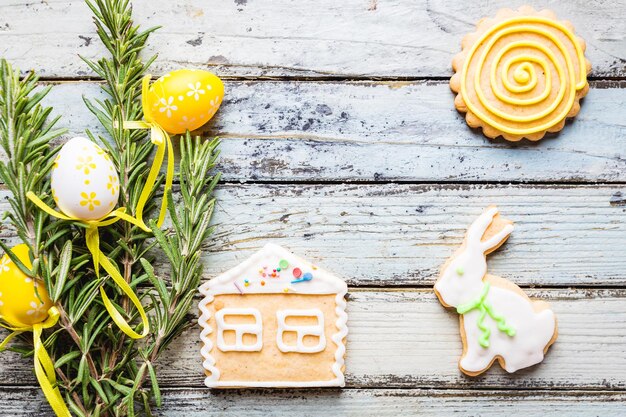 Easter homemade gingerbread cookie over white wooden table