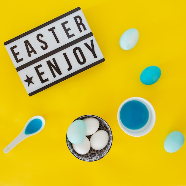 Easter letters with easter eggs on yellow background