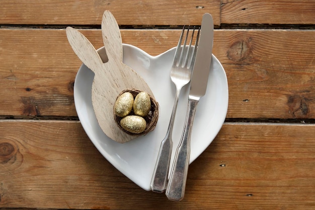 Easter meal table decorated with springtime easter bunny and easter eggs