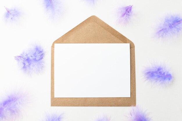 Easter opener with white sheet of paper and envelope with copy space top view