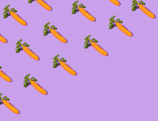 Easter pattern made with carrots Creative minimal holiday concept Diagonal copy space