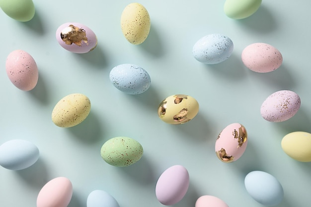 Easter pattern with pastel eggs on blue background