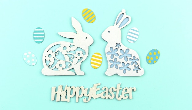 Photo easter poster and banner concept on a pastel blue background with text and cute easter bunny