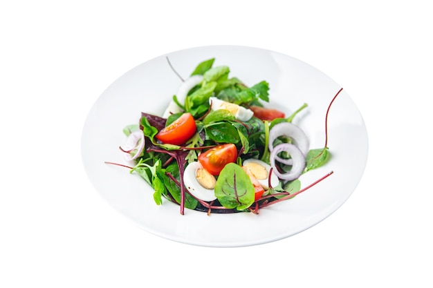 Easter salad quail egg holiday snack tomato lettuce mix leaves healthy meal food on the table