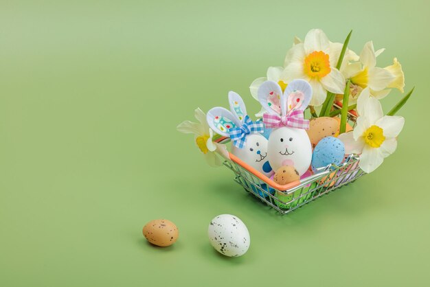 Photo easter sale concept shopping basket with festive symbols rabb