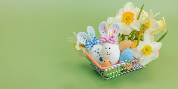 Photo easter sale concept shopping basket with festive symbols rabb