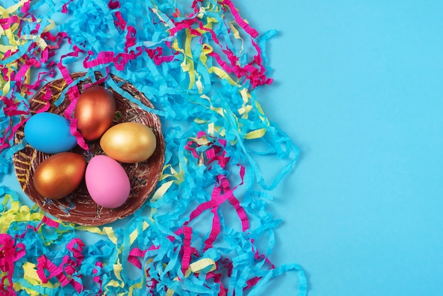 Easter set of colored eggs on bright blue background Easter holiday decorations