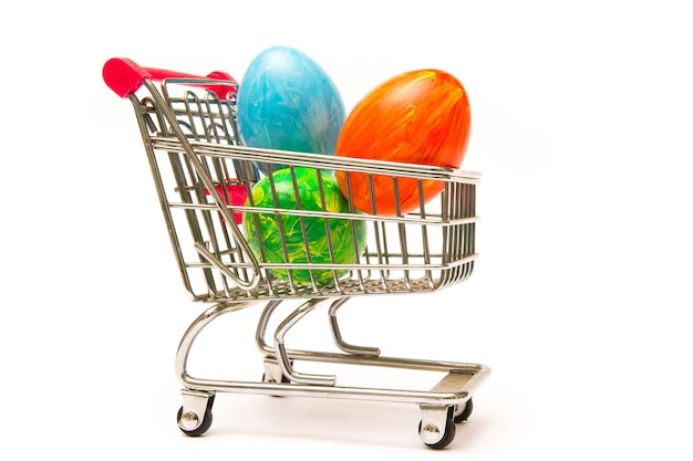 Easter shopping Handmade colored eggs in cart Business and selling in spring