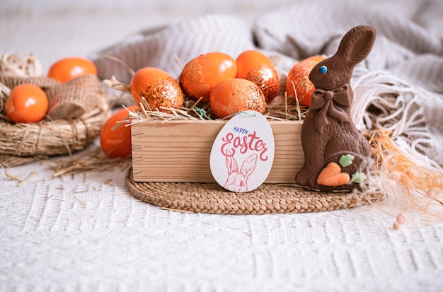 Easter still life with orange eggs, holiday decor