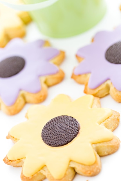 Easter sugar cookies in shape of flower with chocolate icing.