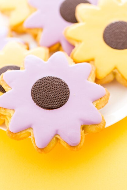 Easter sugar cookies in shape of flower with chocolate icing