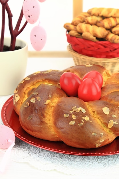 Easter sweet bread with red eggs and shortbread cookies