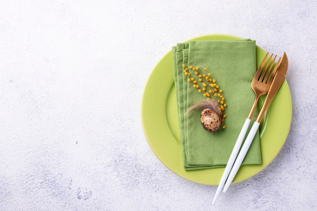 Easter table setting with green plate