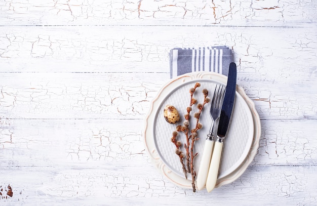 Easter table setting with quail eggs 