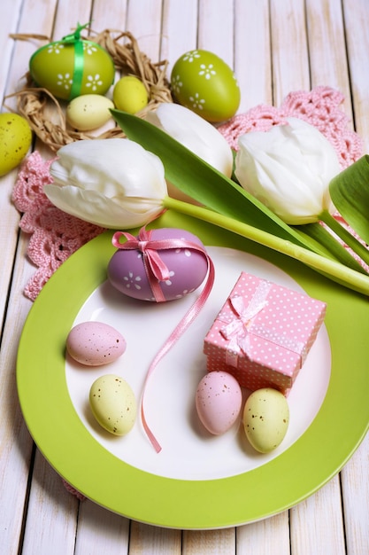 Easter table setting with tulips and eggs