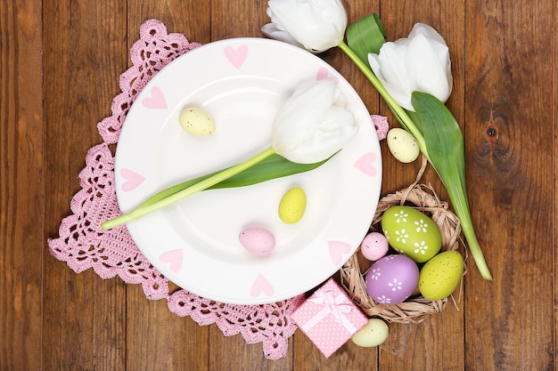 Easter table setting with tulips and eggs