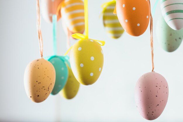 Easter wreath with color eggs on ribbons