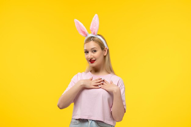 Easter young cute pretty girl with bunny ears smiling cutely