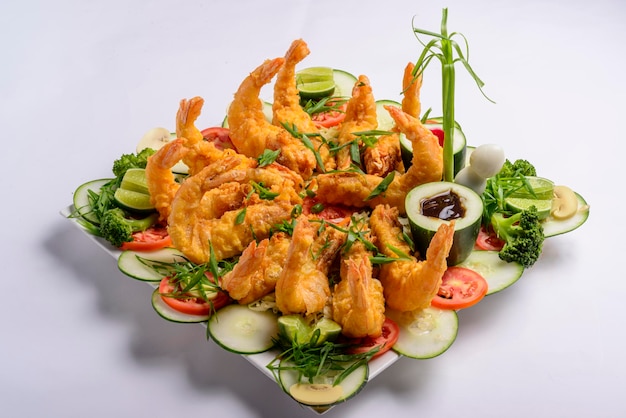 Eastern food Fried crispy shrimp with vegetables on white background