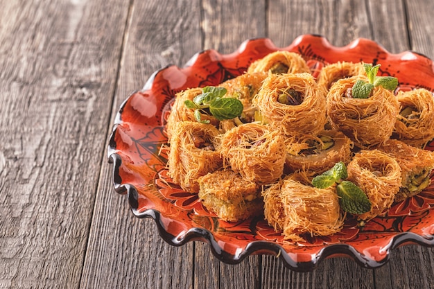 Eastern sweets on an old wooden table