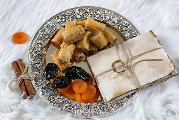 Eastern sweets table on a silver platter baklava and Tamarind snack at the workplace