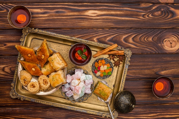 Eastern sweets with tea on table