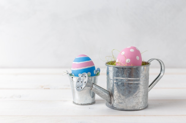 easters eggs on watering can