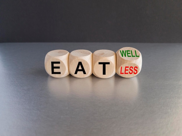 Eat well or less symbol Turned a cube and changed a red word eat less to eat well