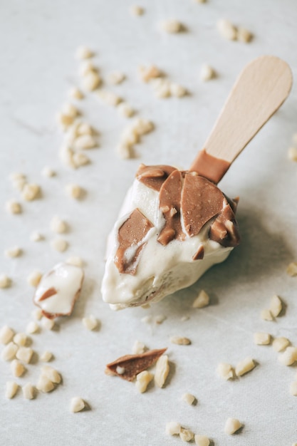 Eaten chocolate almond icecream on a wooden stickTop view