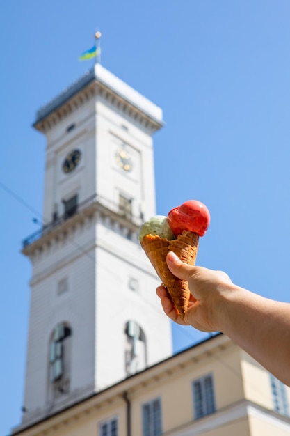 Eating ice cream at hot summer day at Lviv city center