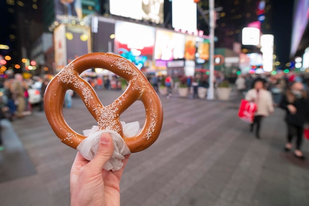 Eating Pretzel fast food in New York City